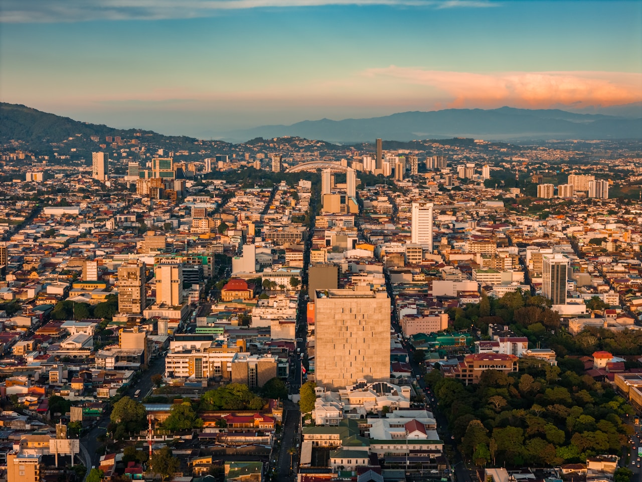 Aerial view of San José, Costa Rica at golden hour with the surrounding mountains